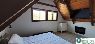 Don't let the outside fool you, this home feels more spacious on Pocono Farms Country Club in Pennsylvania - for sale on GolfHomes.com, golf home, golf lot
