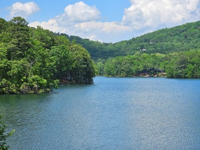 Nestled within the serene and exclusive Big Canoe community in on Big Canoe Golf Club - Cherokee in Georgia - for sale on GolfHomes.com, golf home, golf lot