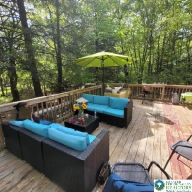 Don't let the outside fool you, this home feels more spacious on Pocono Farms Country Club in Pennsylvania - for sale on GolfHomes.com, golf home, golf lot