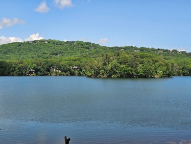 Nestled within the serene and exclusive Big Canoe community in on Big Canoe Golf Club - Cherokee in Georgia - for sale on GolfHomes.com, golf home, golf lot