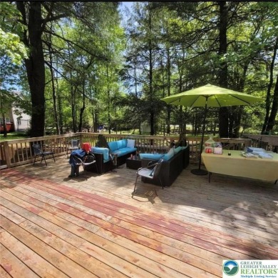 Don't let the outside fool you, this home feels more spacious on Pocono Farms Country Club in Pennsylvania - for sale on GolfHomes.com, golf home, golf lot