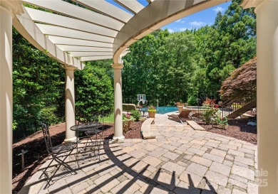 This custom estate embodies luxury, privacy and timeless on The Palisades Country Club in North Carolina - for sale on GolfHomes.com, golf home, golf lot