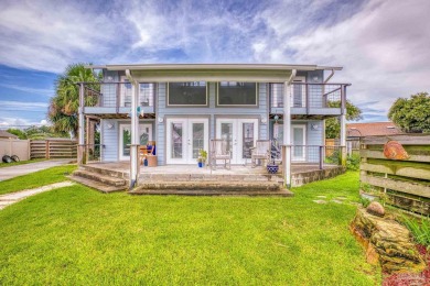 Welcome to this stunning home in the Santa Rosa Shores Canal on Tiger Point Golf and Country Club in Florida - for sale on GolfHomes.com, golf home, golf lot