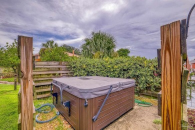 Welcome to this stunning home in the Santa Rosa Shores Canal on Tiger Point Golf and Country Club in Florida - for sale on GolfHomes.com, golf home, golf lot