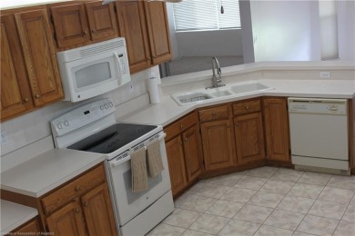 Welcome to this beautifully maintained 4-bedroom, 3-bath on  in Florida - for sale on GolfHomes.com, golf home, golf lot