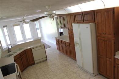 Welcome to this beautifully maintained 4-bedroom, 3-bath on  in Florida - for sale on GolfHomes.com, golf home, golf lot