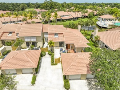 Discover comfort and charm in this well-maintained, light-filled on PGA National Golf Club in Florida - for sale on GolfHomes.com, golf home, golf lot