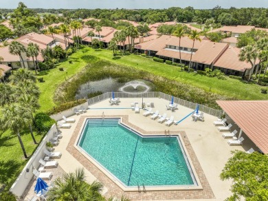 Discover comfort and charm in this well-maintained, light-filled on PGA National Golf Club in Florida - for sale on GolfHomes.com, golf home, golf lot