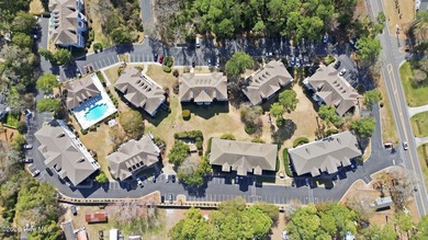 Embrace the essence of coastal living in this beautifully on Oyster Bay Golf Links in North Carolina - for sale on GolfHomes.com, golf home, golf lot