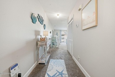 Embrace the essence of coastal living in this beautifully on Oyster Bay Golf Links in North Carolina - for sale on GolfHomes.com, golf home, golf lot