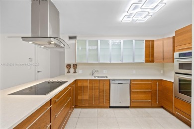 Step into this beautifully remodeled corner unit, where modern on Turnberry Isle Resort and Club in Florida - for sale on GolfHomes.com, golf home, golf lot