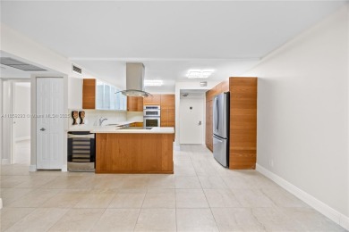 Step into this beautifully remodeled corner unit, where modern on Turnberry Isle Resort and Club in Florida - for sale on GolfHomes.com, golf home, golf lot