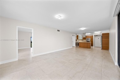 Step into this beautifully remodeled corner unit, where modern on Turnberry Isle Resort and Club in Florida - for sale on GolfHomes.com, golf home, golf lot