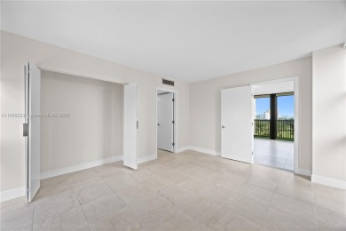 Step into this beautifully remodeled corner unit, where modern on Turnberry Isle Resort and Club in Florida - for sale on GolfHomes.com, golf home, golf lot
