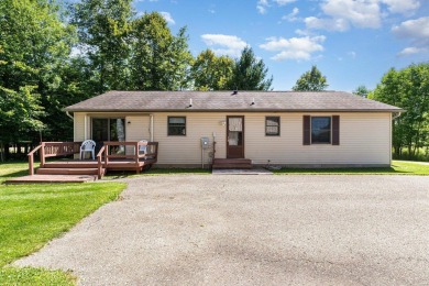 This well-maintained 3 bedroom 2 bath house sits on a double lot on Sugar Springs Country Club in Michigan - for sale on GolfHomes.com, golf home, golf lot