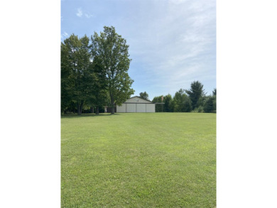 This well-maintained 3 bedroom 2 bath house sits on a double lot on Sugar Springs Country Club in Michigan - for sale on GolfHomes.com, golf home, golf lot