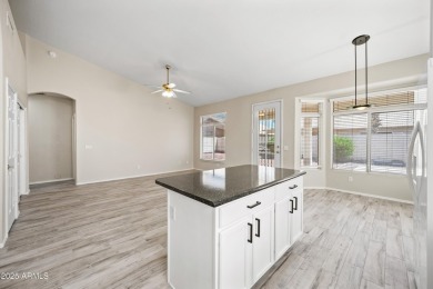 This beautifully updated home offers a spacious layout with a on Palm Valley Golf Club  in Arizona - for sale on GolfHomes.com, golf home, golf lot