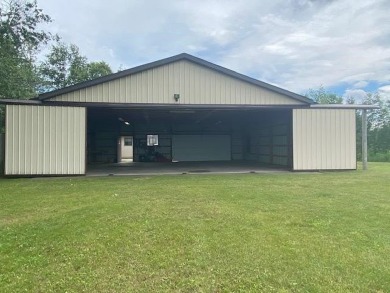 This well-maintained 3 bedroom 2 bath house sits on a double lot on Sugar Springs Country Club in Michigan - for sale on GolfHomes.com, golf home, golf lot