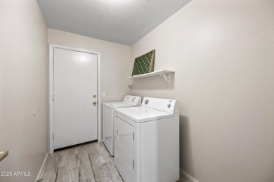 This beautifully updated home offers a spacious layout with a on Palm Valley Golf Club  in Arizona - for sale on GolfHomes.com, golf home, golf lot