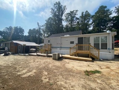 Large Park Trailer with two bedrooms.  One and one half on Captains Cove Golf and Yacht Club in Virginia - for sale on GolfHomes.com, golf home, golf lot