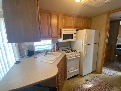 Large Park Trailer with two bedrooms.  One and one half on Captains Cove Golf and Yacht Club in Virginia - for sale on GolfHomes.com, golf home, golf lot