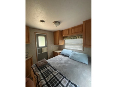 Large Park Trailer with two bedrooms.  One and one half on Captains Cove Golf and Yacht Club in Virginia - for sale on GolfHomes.com, golf home, golf lot