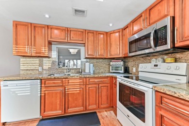 Discover resplendent living at the serene 2802 Victoria Way K4 on Wynmoor Golf Course in Florida - for sale on GolfHomes.com, golf home, golf lot