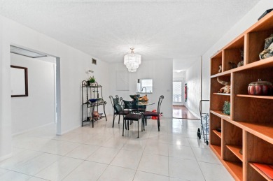 Discover resplendent living at the serene 2802 Victoria Way K4 on Wynmoor Golf Course in Florida - for sale on GolfHomes.com, golf home, golf lot
