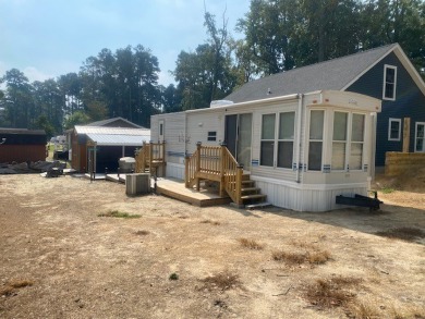 Large Park Trailer with two bedrooms.  One and one half on Captains Cove Golf and Yacht Club in Virginia - for sale on GolfHomes.com, golf home, golf lot