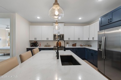 Immaculate upper-end Harborwalk condo built in 2023, offering 3 on Members Club At St. James Plantation in North Carolina - for sale on GolfHomes.com, golf home, golf lot