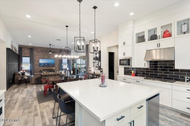 Sleek, modern house with an open-concept floor plan that offers on Verrado Golf Club - Victory in Arizona - for sale on GolfHomes.com, golf home, golf lot