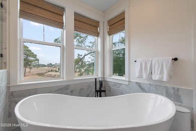 Immaculate upper-end Harborwalk condo built in 2023, offering 3 on Members Club At St. James Plantation in North Carolina - for sale on GolfHomes.com, golf home, golf lot