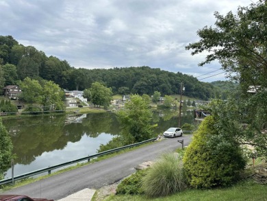 Enjoy the scenic waterfront view from your living room window on Lake Floyd Golf Club, Inc. in West Virginia - for sale on GolfHomes.com, golf home, golf lot