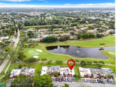 Welcome to this exceptional corner townhouse in the heart of on Pembroke Lakes Golf Club in Florida - for sale on GolfHomes.com, golf home, golf lot