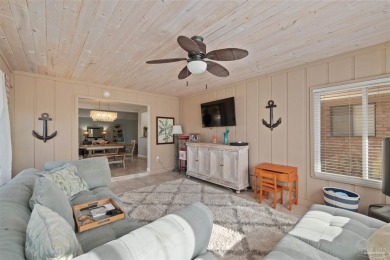 Enjoy the Gulf Breeze lifestyle in this waterfront home with on Tiger Point Golf and Country Club in Florida - for sale on GolfHomes.com, golf home, golf lot