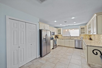 Enjoy the Gulf Breeze lifestyle in this waterfront home with on Tiger Point Golf and Country Club in Florida - for sale on GolfHomes.com, golf home, golf lot