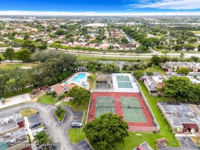 Welcome to this exceptional corner townhouse in the heart of on Pembroke Lakes Golf Club in Florida - for sale on GolfHomes.com, golf home, golf lot