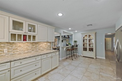 Enjoy the Gulf Breeze lifestyle in this waterfront home with on Tiger Point Golf and Country Club in Florida - for sale on GolfHomes.com, golf home, golf lot