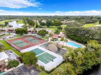 Welcome to this exceptional corner townhouse in the heart of on Pembroke Lakes Golf Club in Florida - for sale on GolfHomes.com, golf home, golf lot