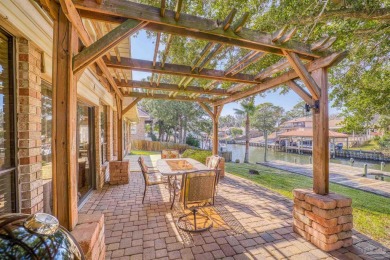 Enjoy the Gulf Breeze lifestyle in this waterfront home with on Tiger Point Golf and Country Club in Florida - for sale on GolfHomes.com, golf home, golf lot