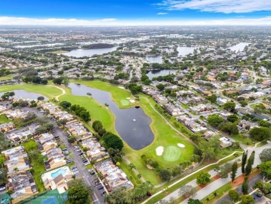 Welcome to this exceptional corner townhouse in the heart of on Pembroke Lakes Golf Club in Florida - for sale on GolfHomes.com, golf home, golf lot