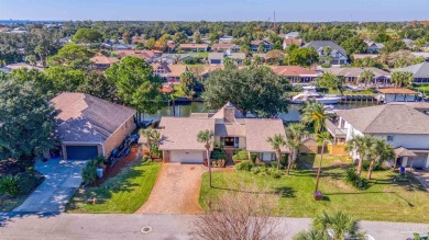 Enjoy the Gulf Breeze lifestyle in this waterfront home with on Tiger Point Golf and Country Club in Florida - for sale on GolfHomes.com, golf home, golf lot