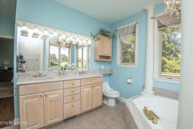 Golf course views, sun-filled rooms, and a massive 23x43 4-car on Tellico Village -The Links At Kahite Golf Course in Tennessee - for sale on GolfHomes.com, golf home, golf lot