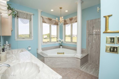Golf course views, sun-filled rooms, and a massive 23x43 4-car on Tellico Village -The Links At Kahite Golf Course in Tennessee - for sale on GolfHomes.com, golf home, golf lot