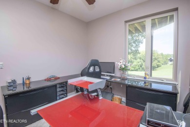 Golf course views, sun-filled rooms, and a massive 23x43 4-car on Tellico Village -The Links At Kahite Golf Course in Tennessee - for sale on GolfHomes.com, golf home, golf lot