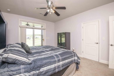 Golf course views, sun-filled rooms, and a massive 23x43 4-car on Tellico Village -The Links At Kahite Golf Course in Tennessee - for sale on GolfHomes.com, golf home, golf lot