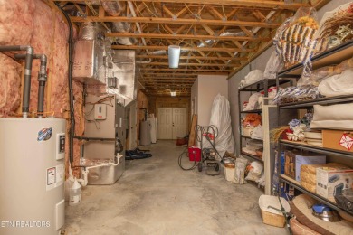 Golf course views, sun-filled rooms, and a massive 23x43 4-car on Tellico Village -The Links At Kahite Golf Course in Tennessee - for sale on GolfHomes.com, golf home, golf lot