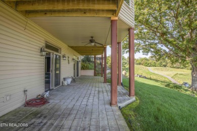 Golf course views, sun-filled rooms, and a massive 23x43 4-car on Tellico Village -The Links At Kahite Golf Course in Tennessee - for sale on GolfHomes.com, golf home, golf lot