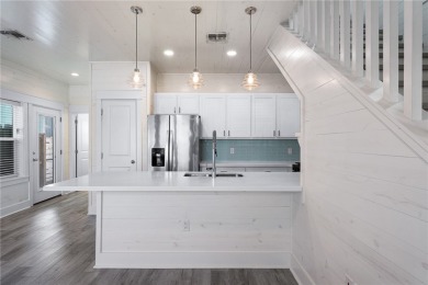 Charming coastal cottage in the desirable Nautilus Subdivision on Palmilla Beach Golf Club in Texas - for sale on GolfHomes.com, golf home, golf lot