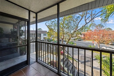 This remodeled second-floor unit features a fireplace and a on Feather Sound Country Club in Florida - for sale on GolfHomes.com, golf home, golf lot